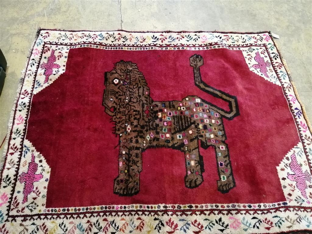A North West Persian red ground Lion rug, 176 x 142cm